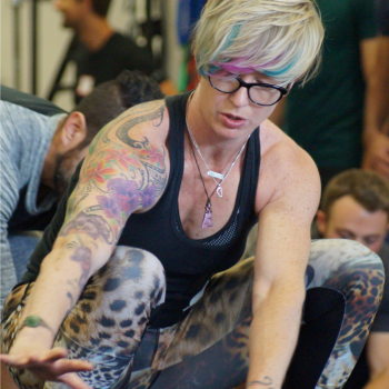 Woman in deep squat moving to the side