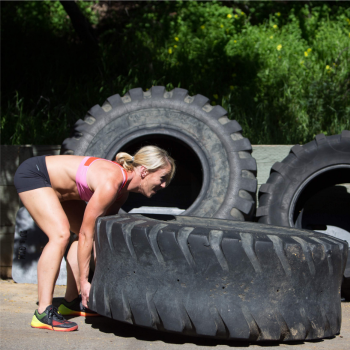 Woman flipping tire
