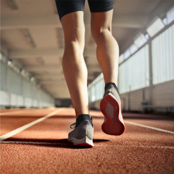 Woman running on track