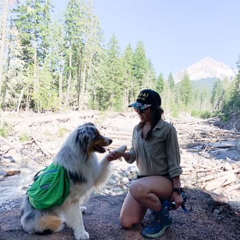 woman hiking with dog