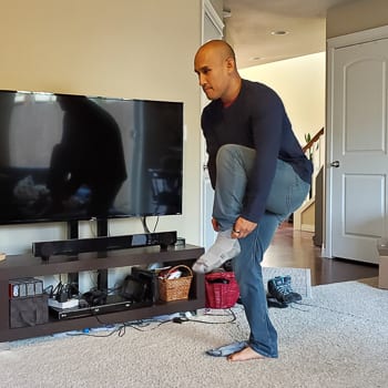 putting on socks standing on one leg NEAT