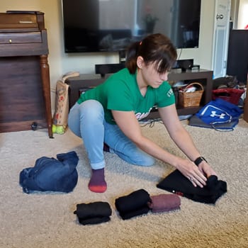 NEAT folding laundry on floor